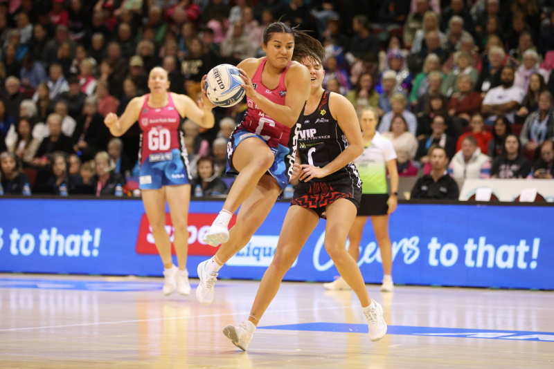 Kimiora Poi prepares to land with the ball for the Southern Steel against the Mainland Tactix...