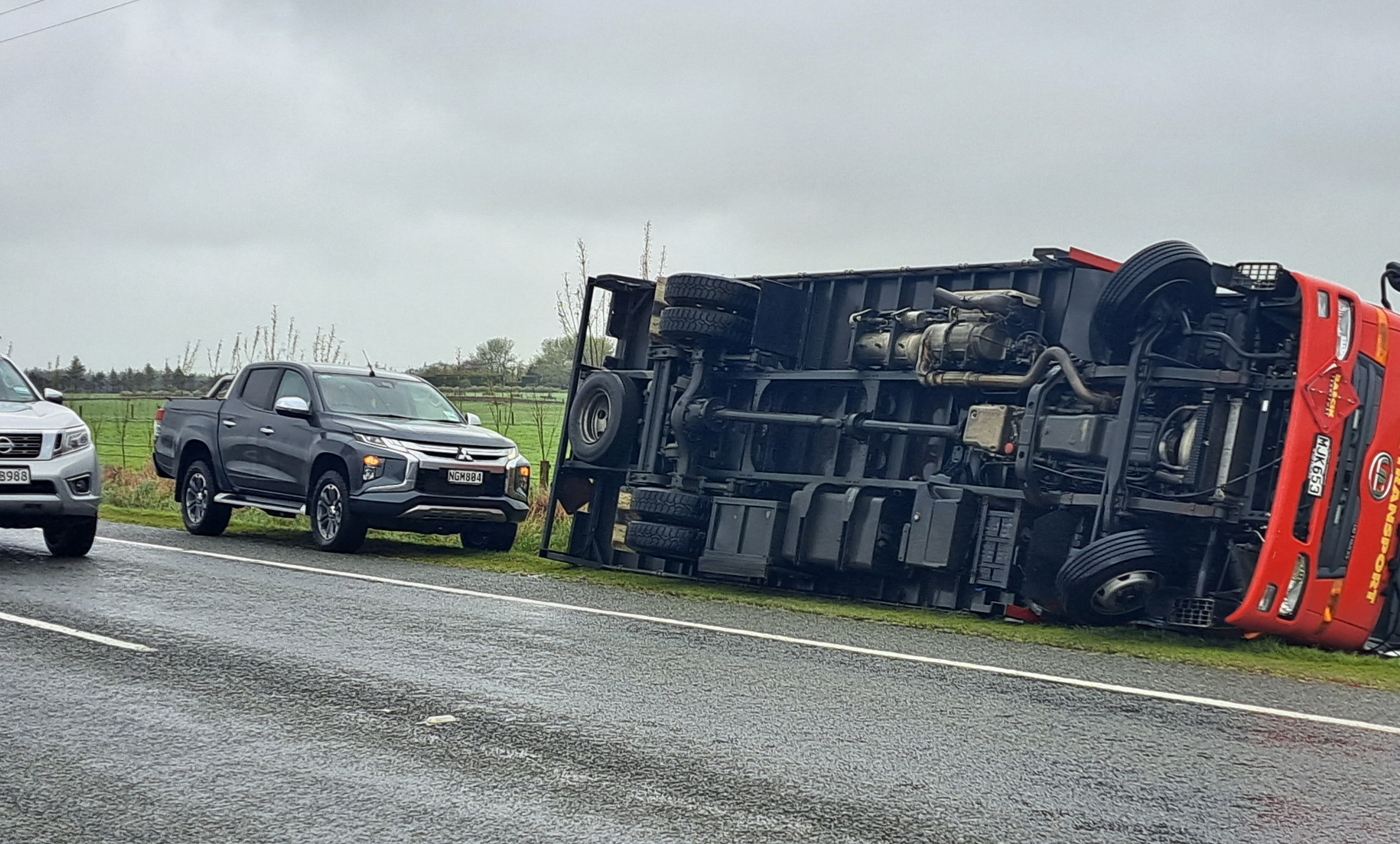 A truck on its side on the Gore-Invercargill highway. Photo: Gerrit Doppenberg