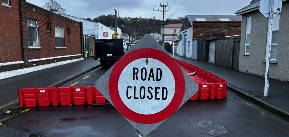 The council closed Surrey St early yesterday afternoon and installed a flood protection barrier....
