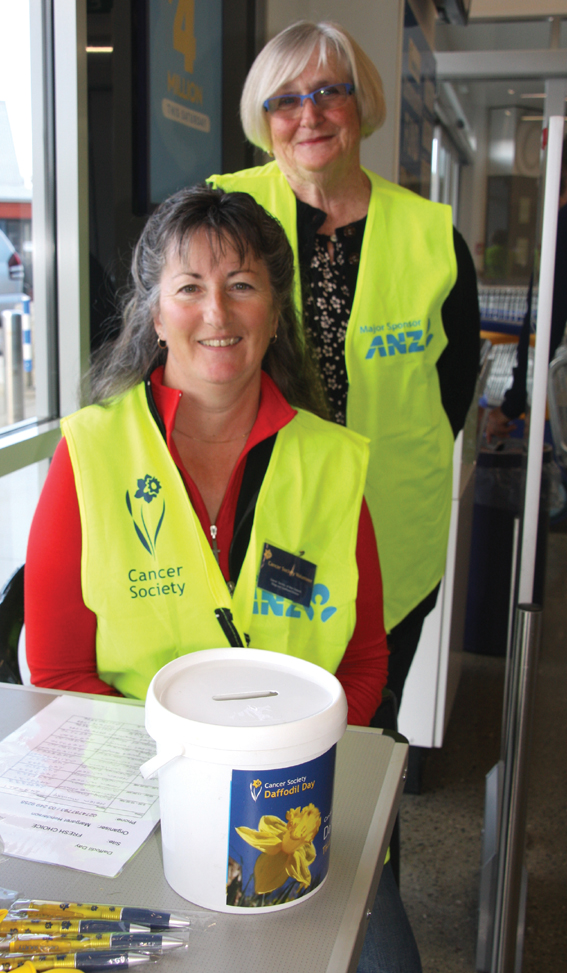 Volunteers Jo Wilson and Agnes Harvey (standing) manning the station at Fresh Choice Te Anau....