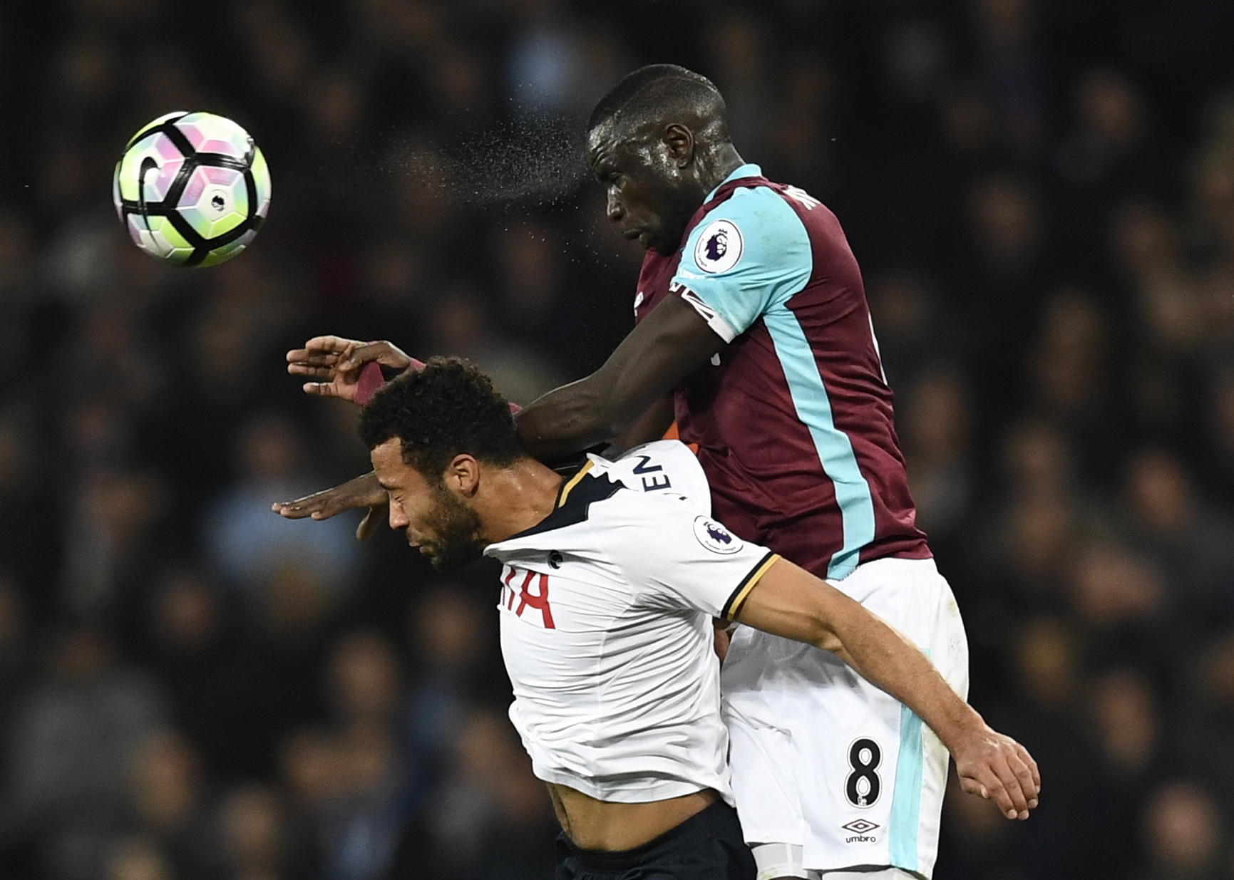 West Ham United's Cheikhou Kouyate (above) Tottenham's Kyle Walker compete for the ball. Photo:...