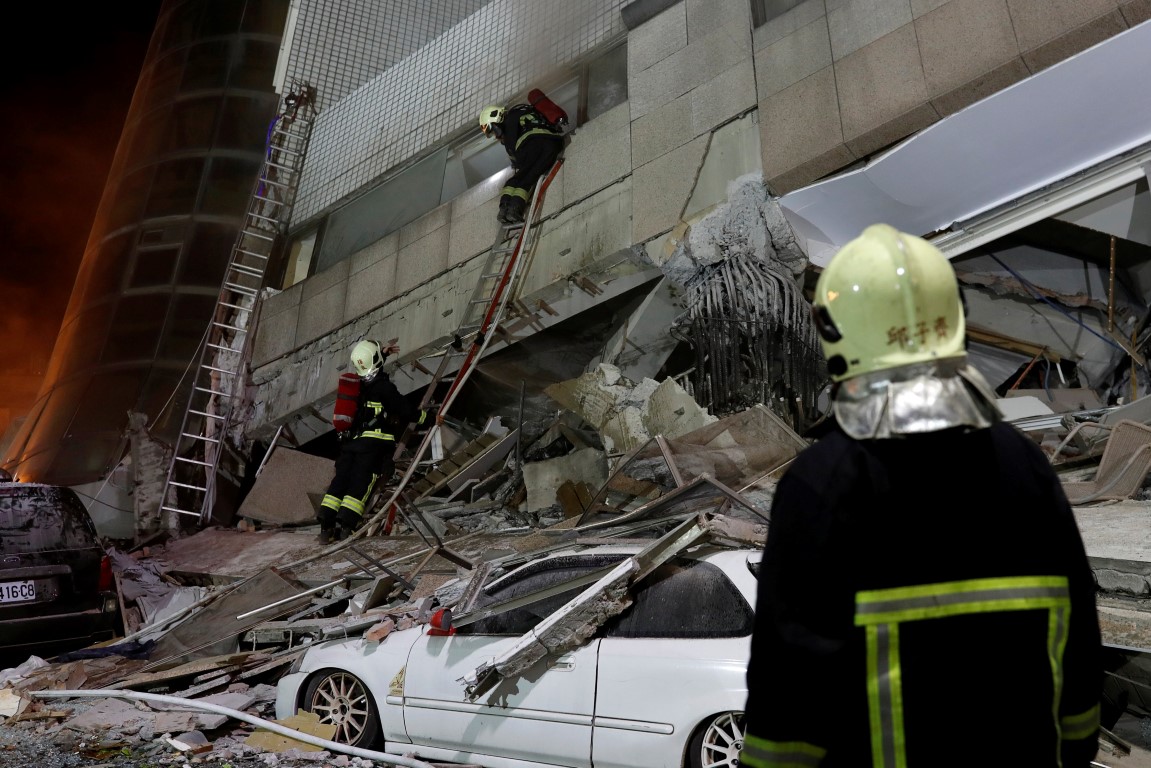 A fireman works at a collapsed building after the earthquake hit Hualien. Photo Reuters