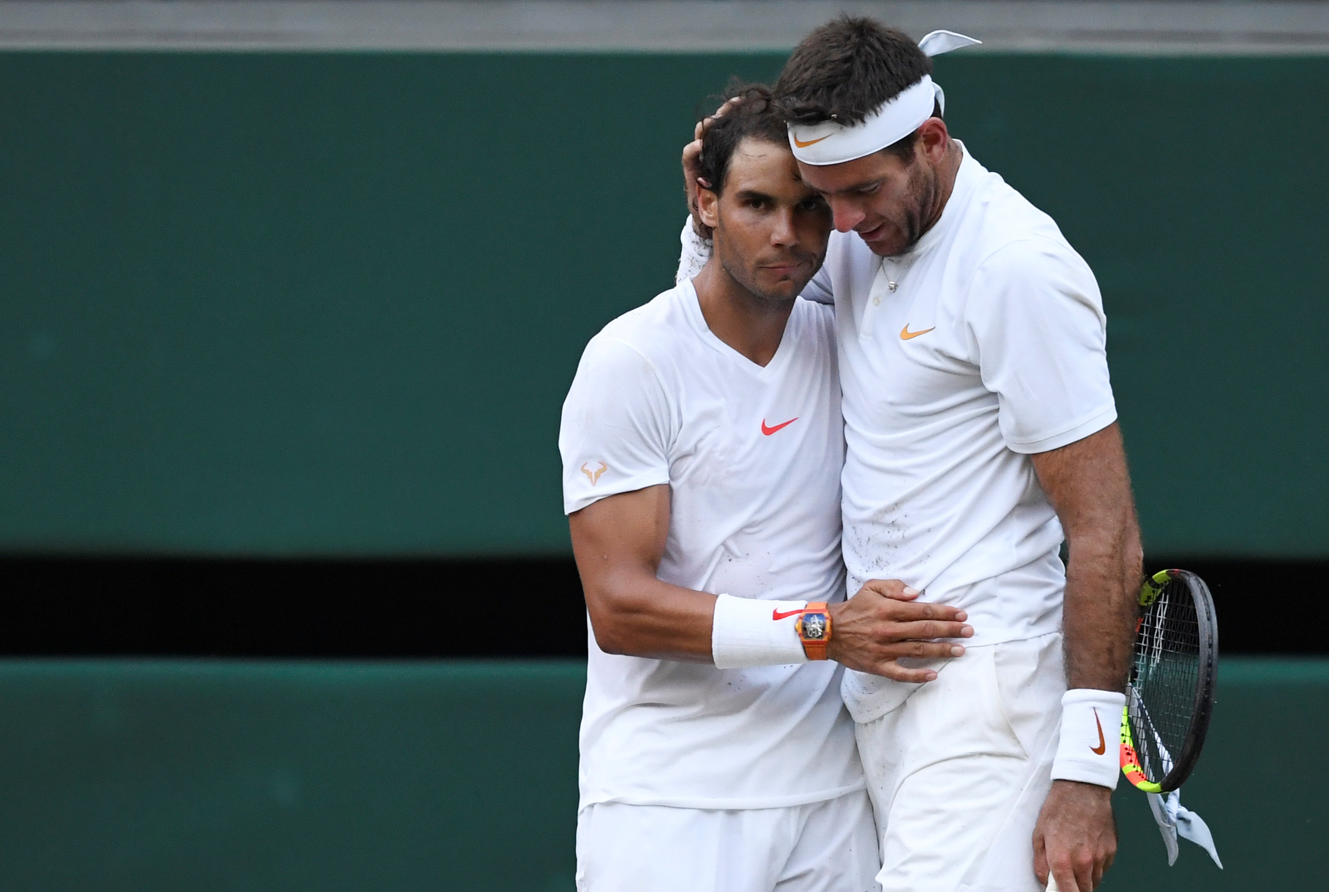 Rafael Nadal embraces Juan Martin Del Potro at the end of the five-set match. Photo: Reuters 