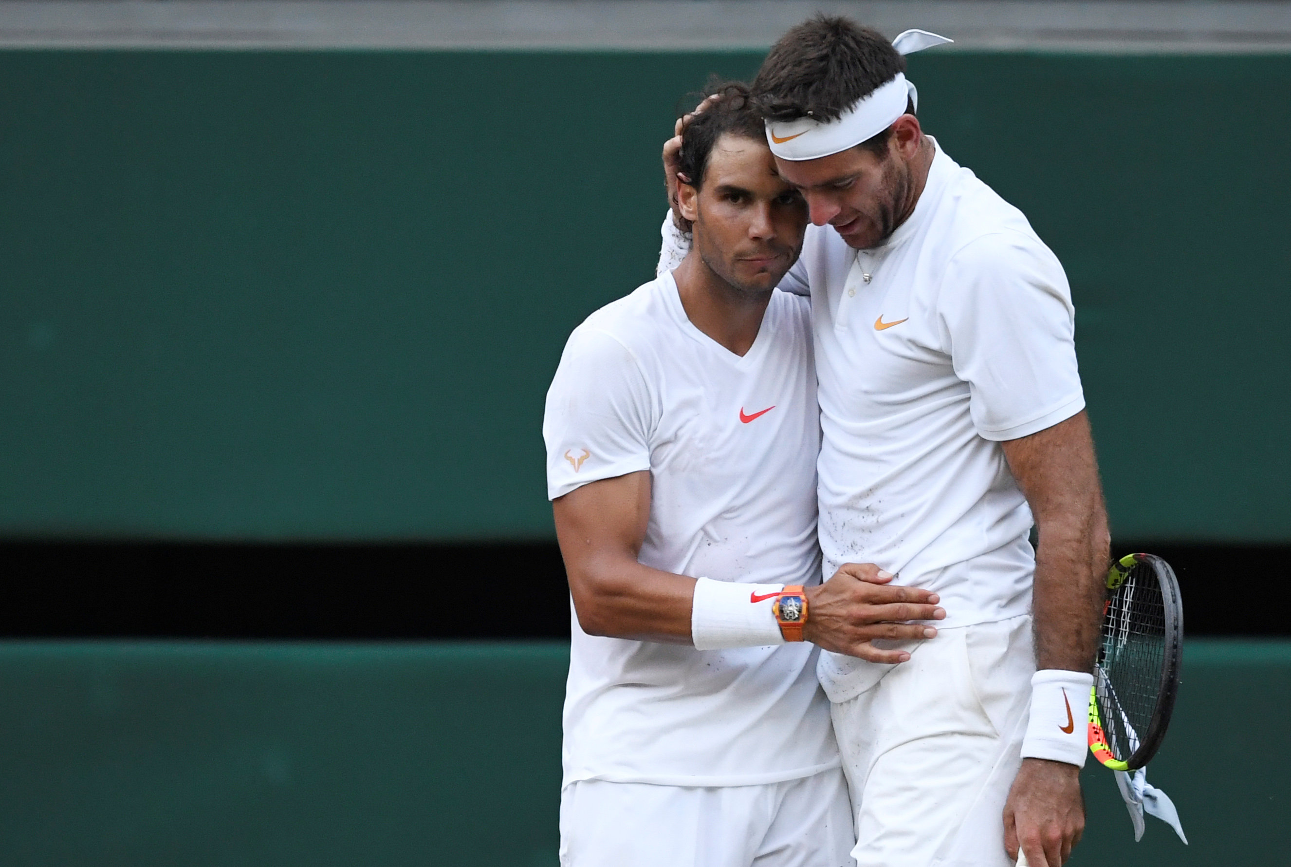 Rafael Nadal embraces Juan Martin Del Potro at the end of the five-set match. Photo: Reuters