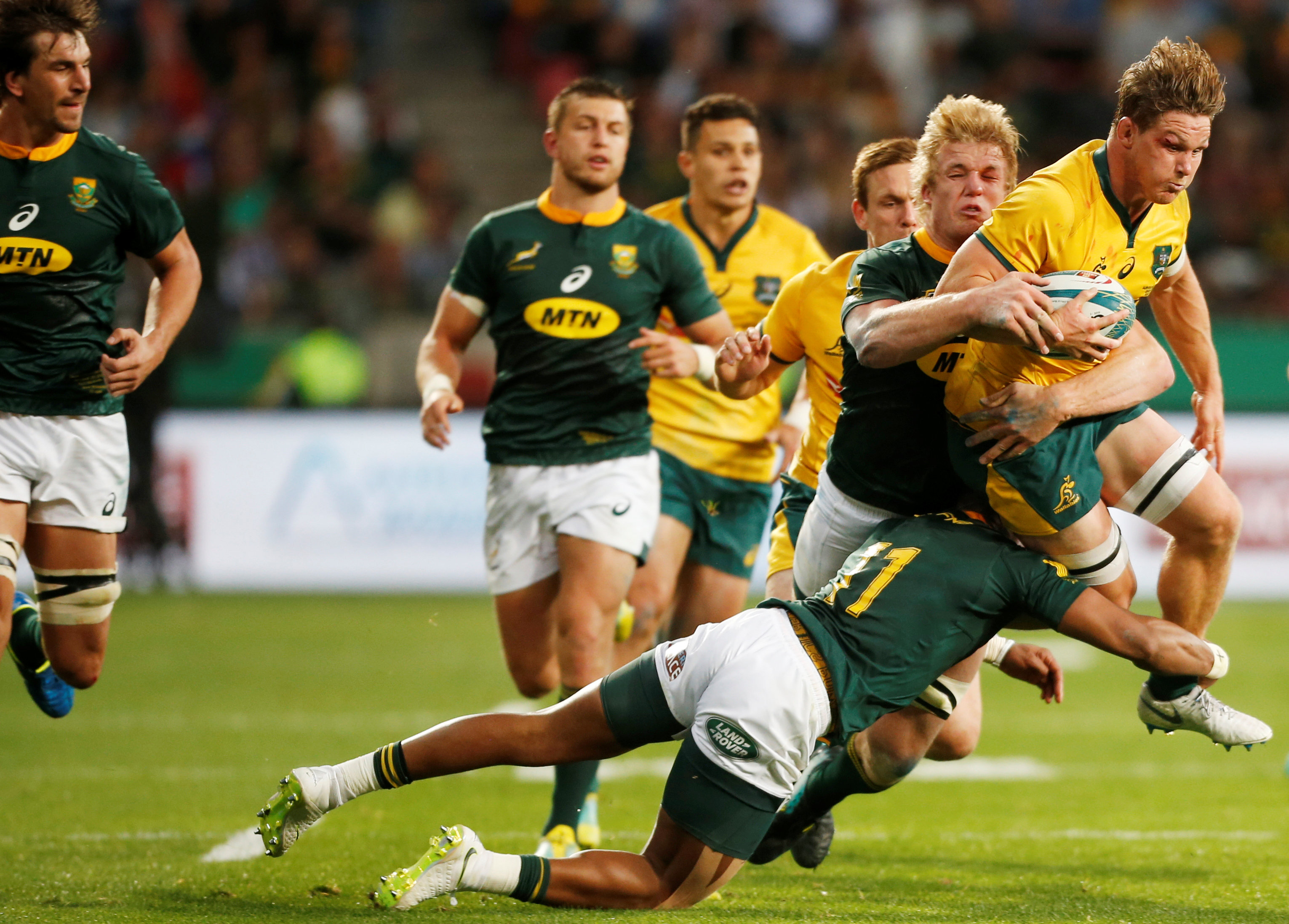 Australia's captain Michael Hooper gets tied up in a tackle. Photo: Reuters 
