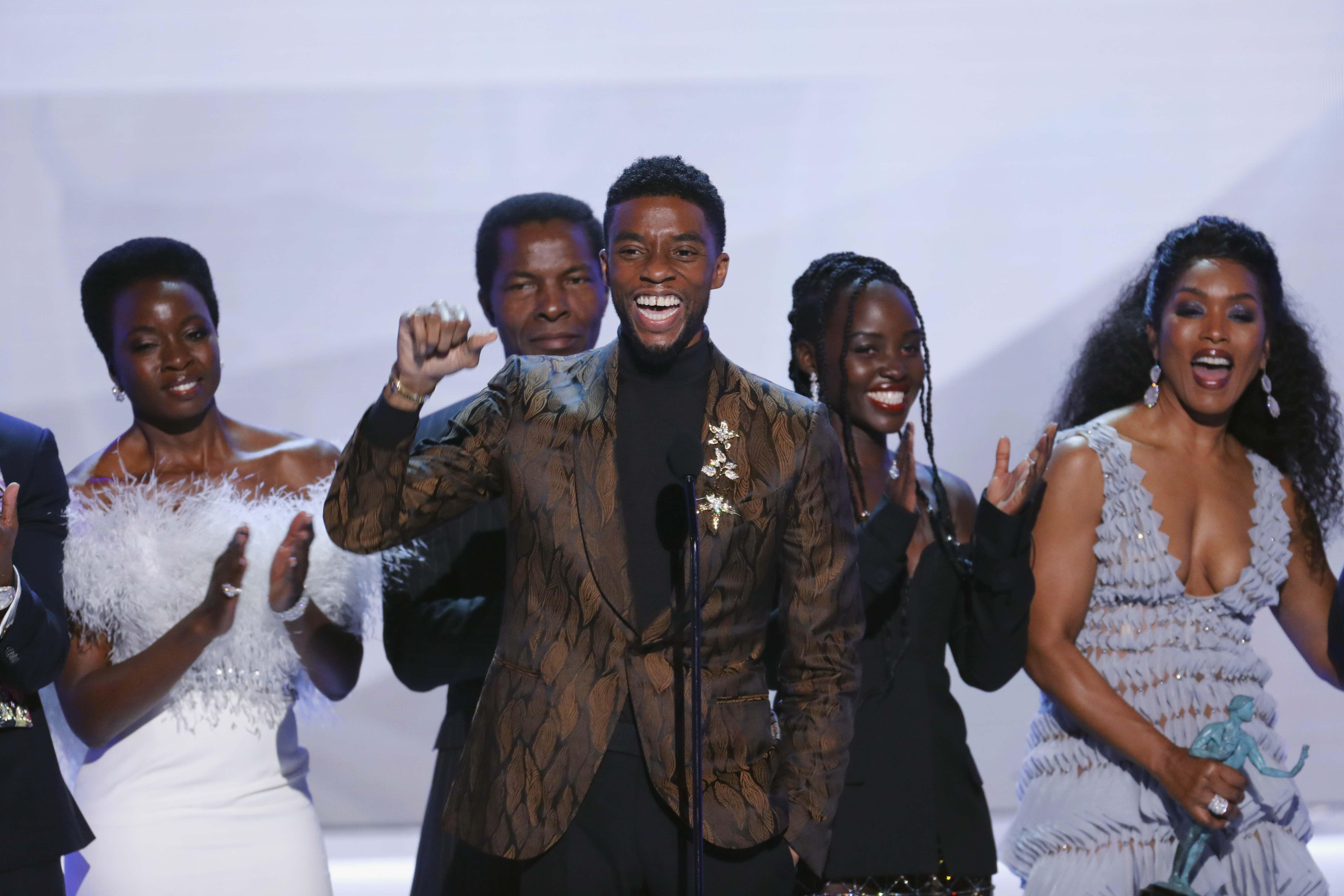 Chadwick Boseman (centre) with the cast of Black Panther. Photo: Reuters
