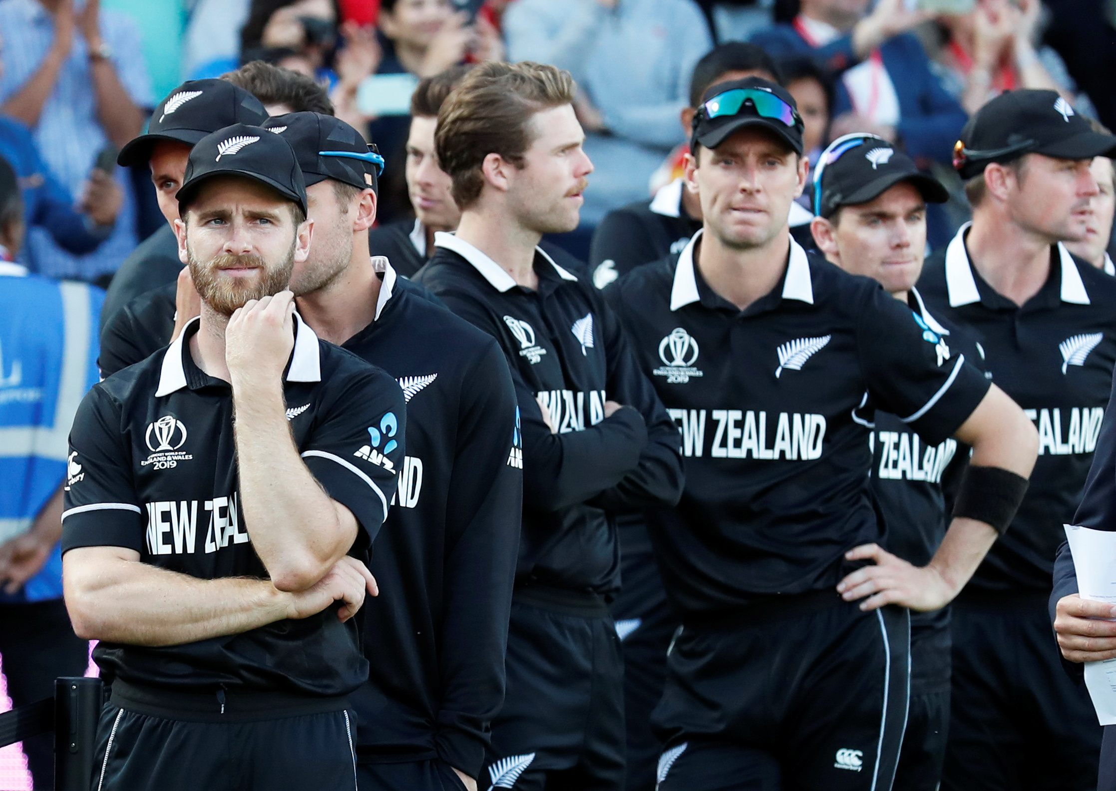 A disappointed Kane Williamson (left) waits with the Black Caps for their medals . Photo: Action...