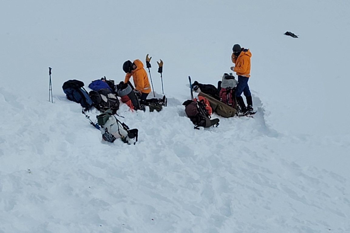 Alaska Mountain Rescue Group volunteers assemble near the site of the helicopter crash. Photo:...