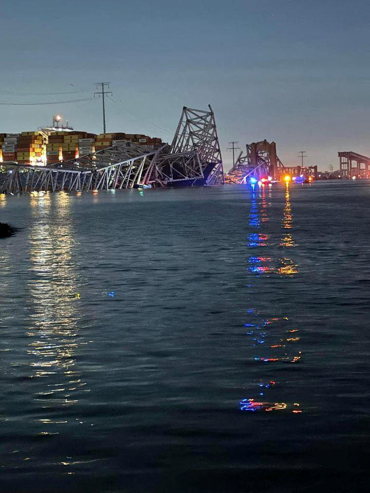 The container ship 'Dali' sits in the water by the collapsed Francis Scott Key Bridge in...