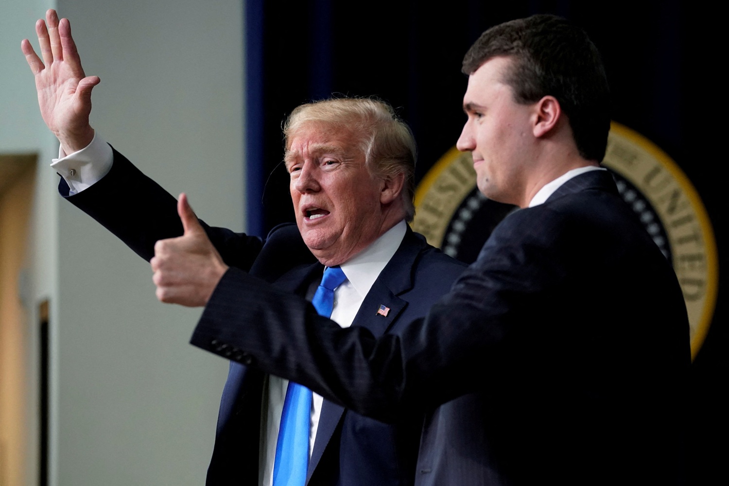 US President Donald Trump concludes an onstage interview with moderator Charlie Kirk during a...