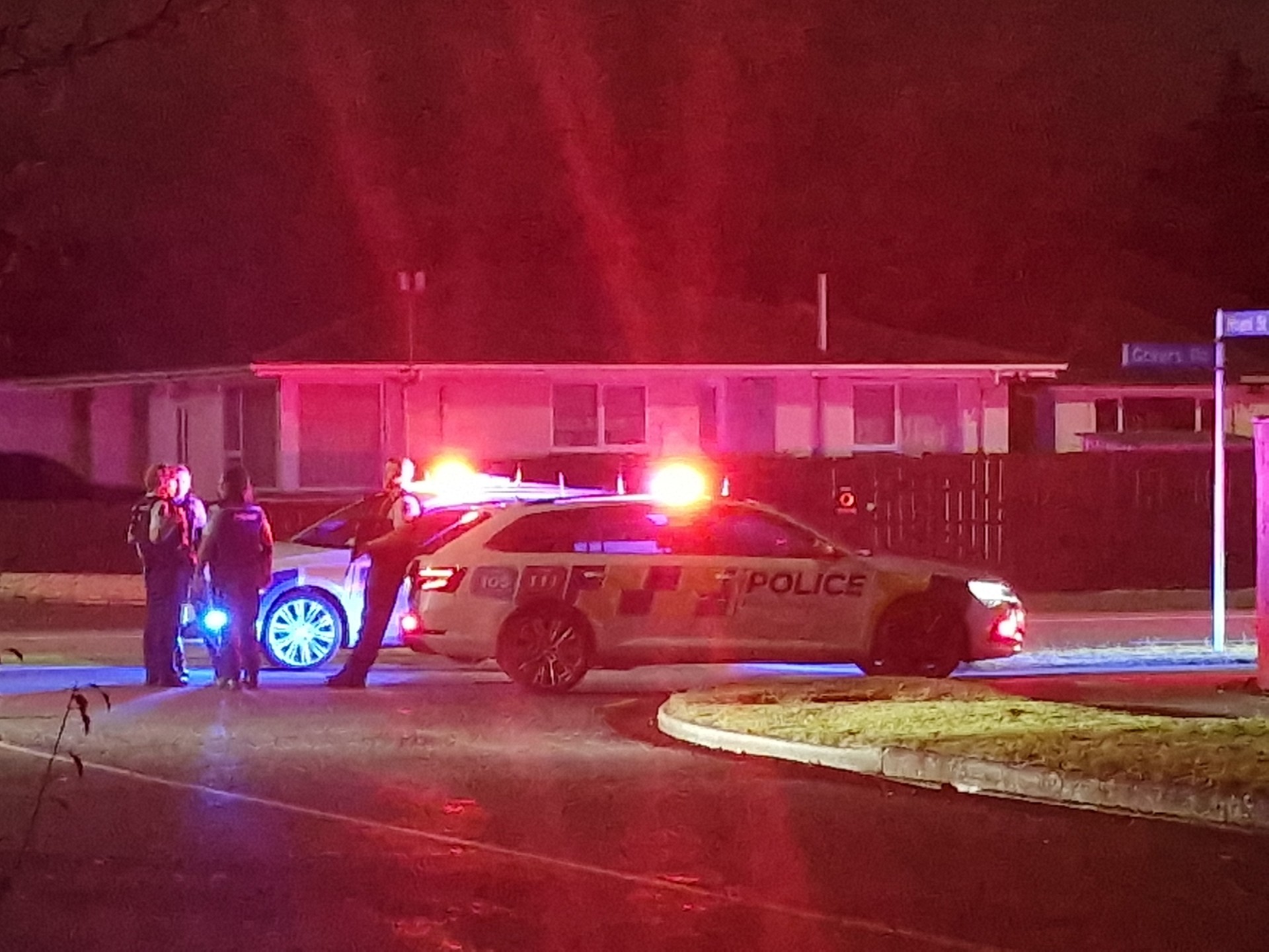 Police at the scene on Hoani Street, Northcote, late last night. Photo: Dylan Smits

