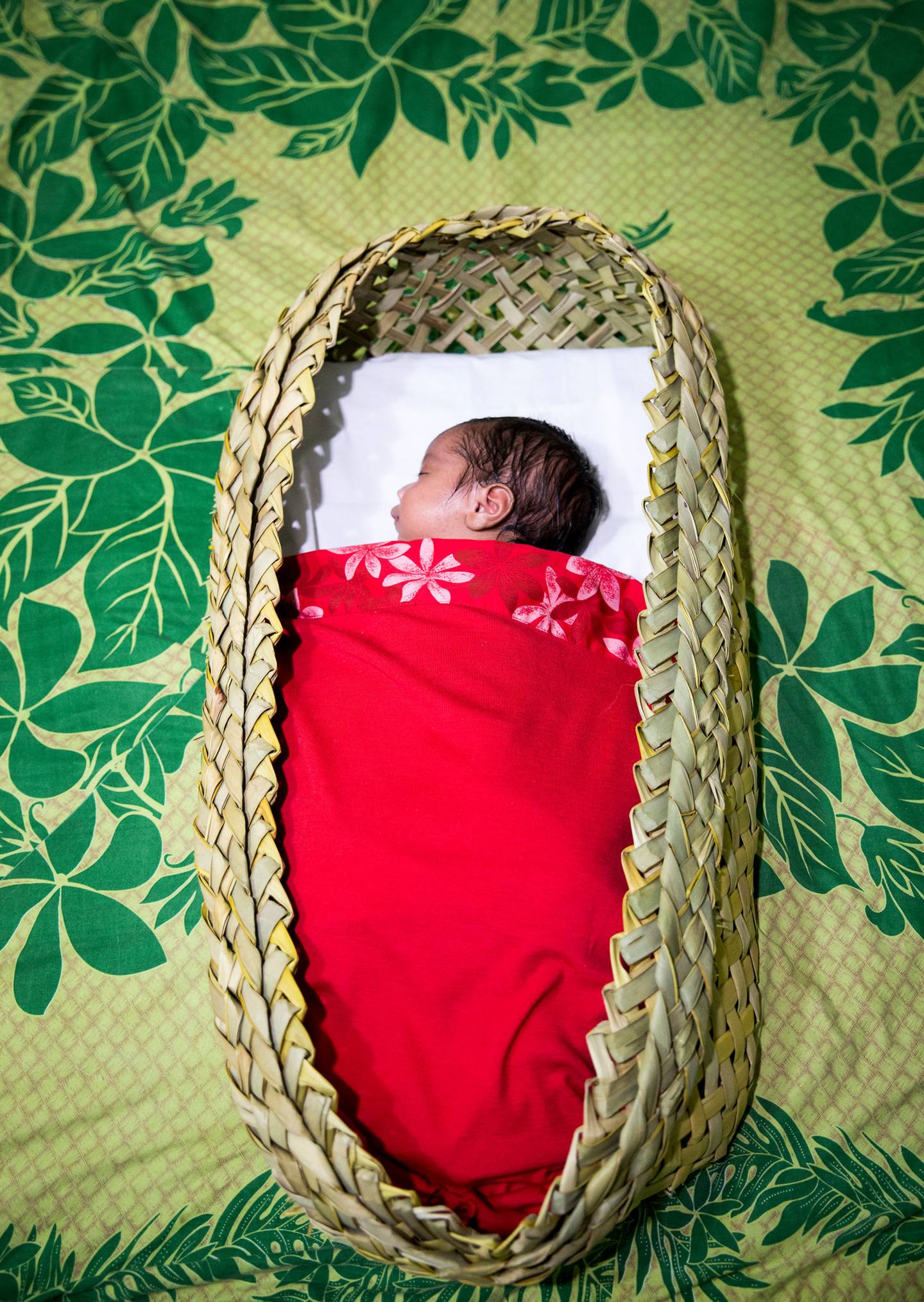 A 1-month-old baby sleeping safely in a wahakura. In 2020, 56 New Zealand babies died from Sudden...