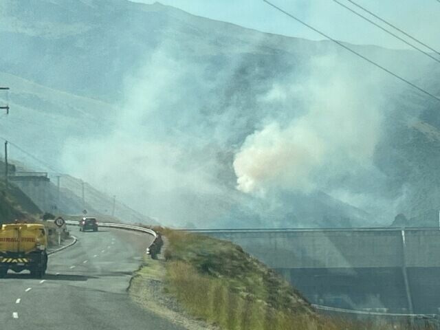 Crews worked to keep the fire away from lines over the dam. Photo: Fire and Emergency NZ 