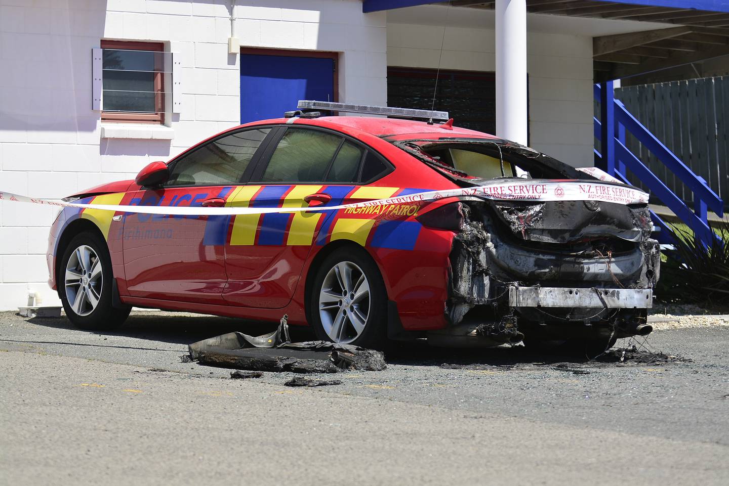 This police car was torched in front of the Papamoa Police Station in November 2019. Photo: Bay...