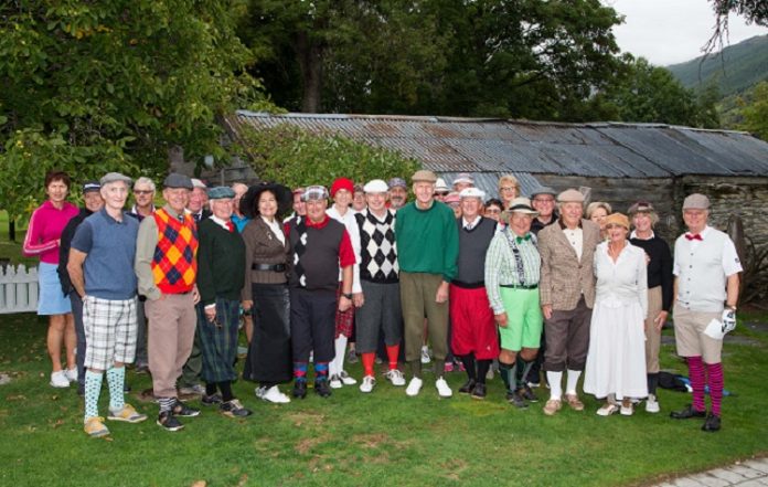 Millbrook Country Club members in vintage golf attire about to celebrate the resort's silver...
