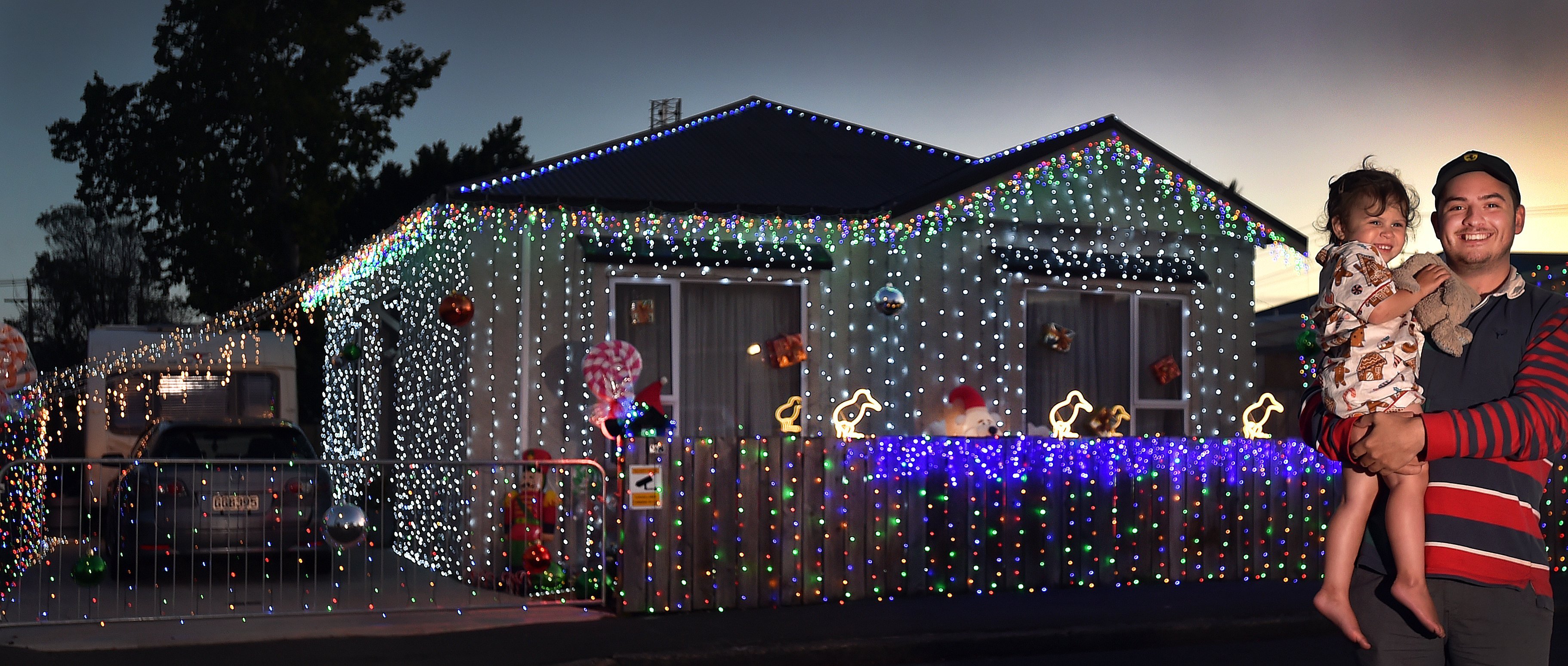 Conrad Thomas and Heidi Orr (2) outside their heavily decorated home at 98 Fawcett St, South...