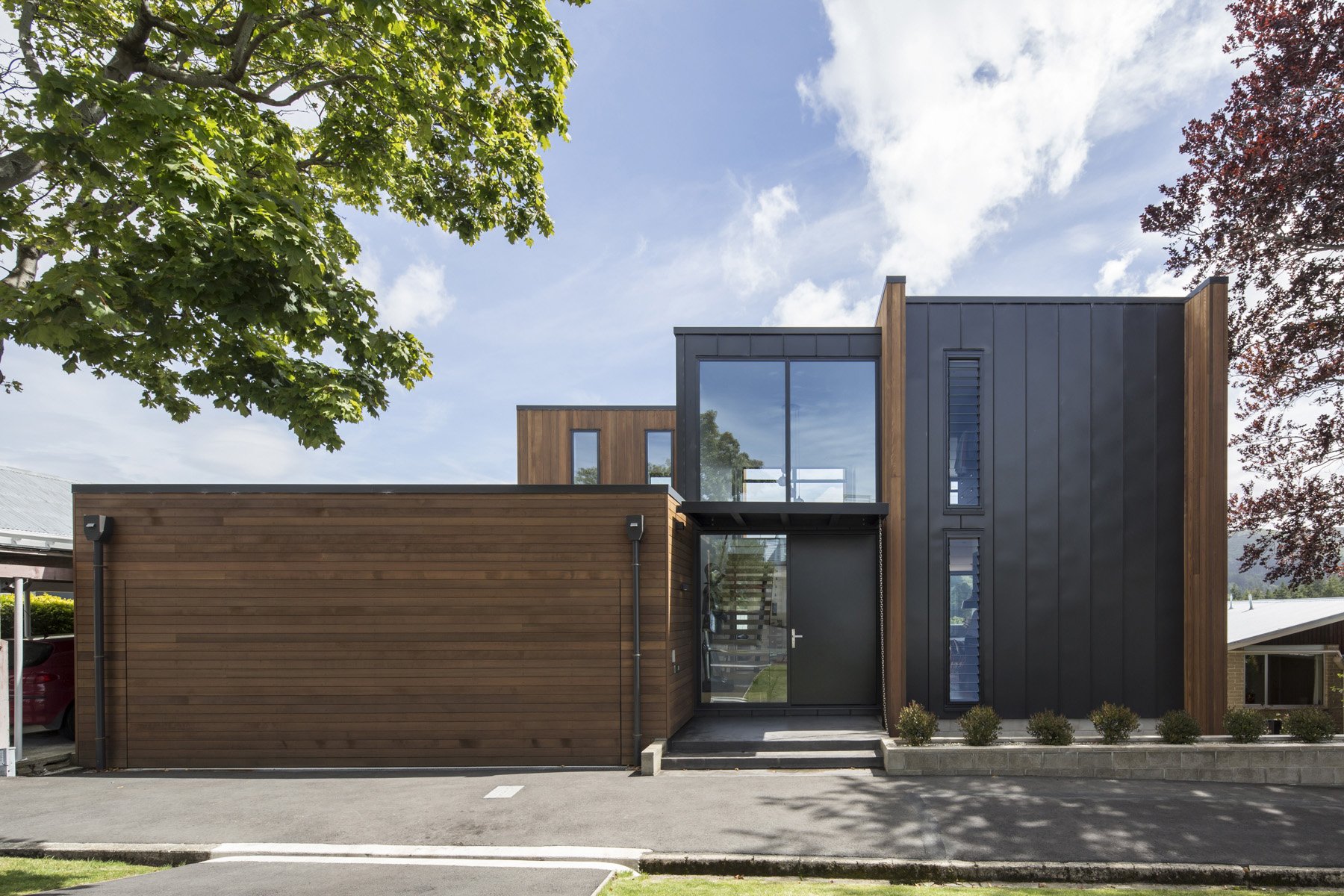  Built on a small section in Maori Hill, this home is three storeys high, not two as it appears from the street. The garage has a concealed door which is wide enough to allow cars to drive in either side of a tree on the grass verge. PHOTO: GRAHAM WARMAN