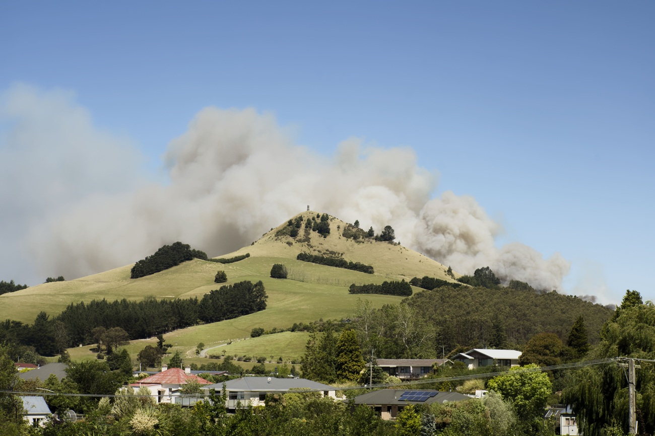 Smoke from the Goodwood fire rises above Puketapu, near Palmerston. Photo: Dwindle River Studio