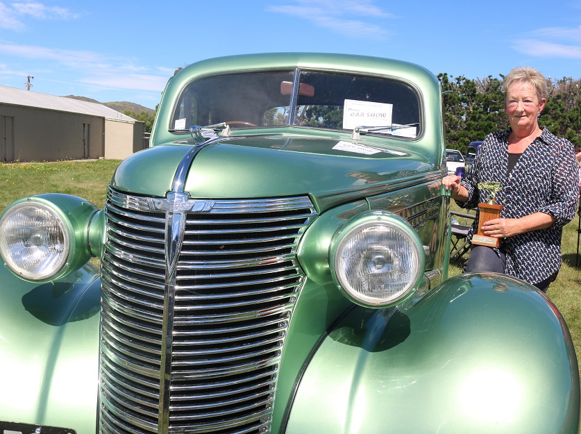 Joy Fleet, of the Taieri, shows off the trophy her 1938 Chevy Coupe won  in the Best Vintage...