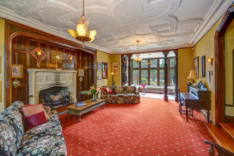 The formal lounge has a large fireplace in a panelled recess. "It throws out an amazing heat, but...