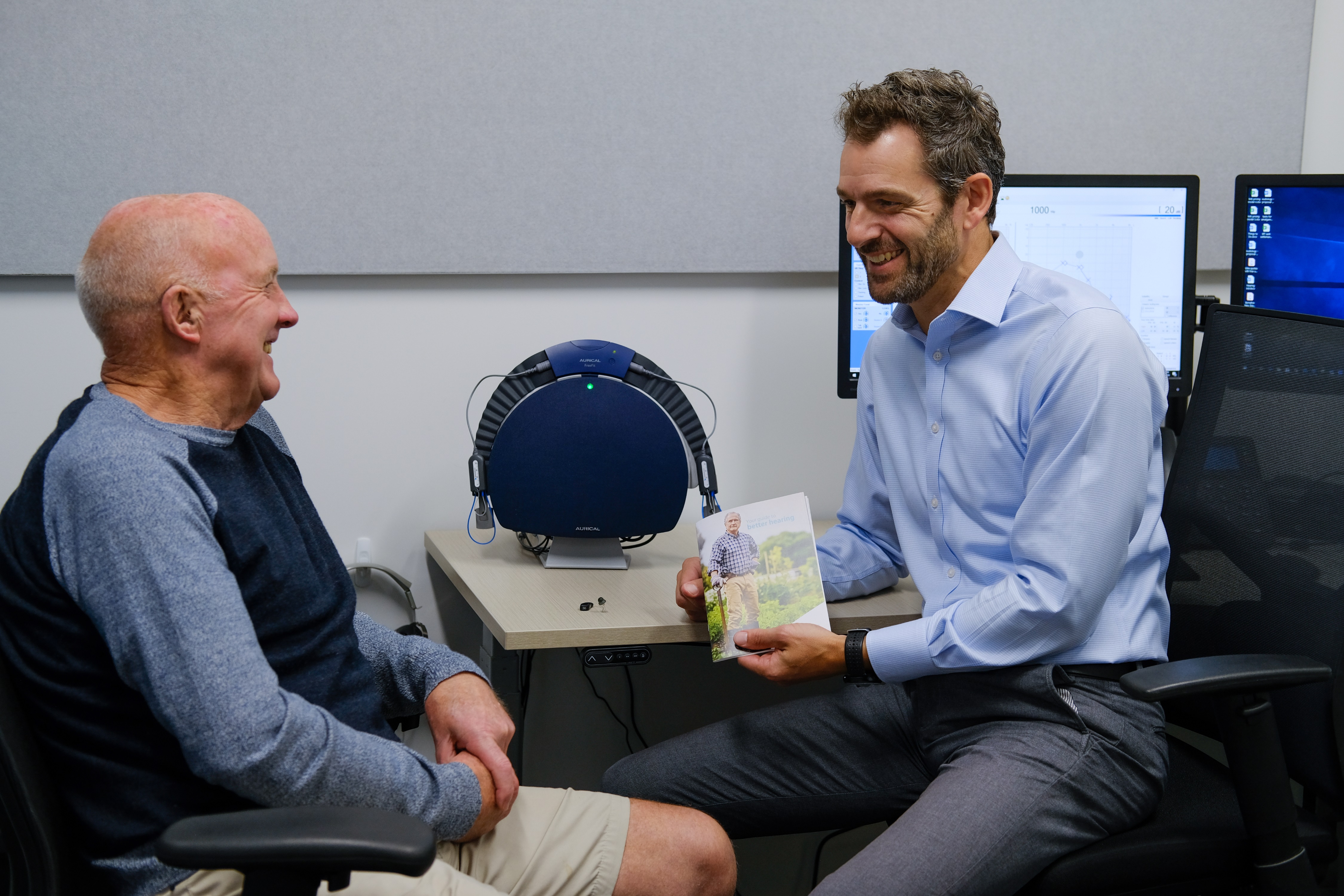 Audiologist Anthony Rowcroft with client, Commonwealth Games gold medallist Dick Tayler