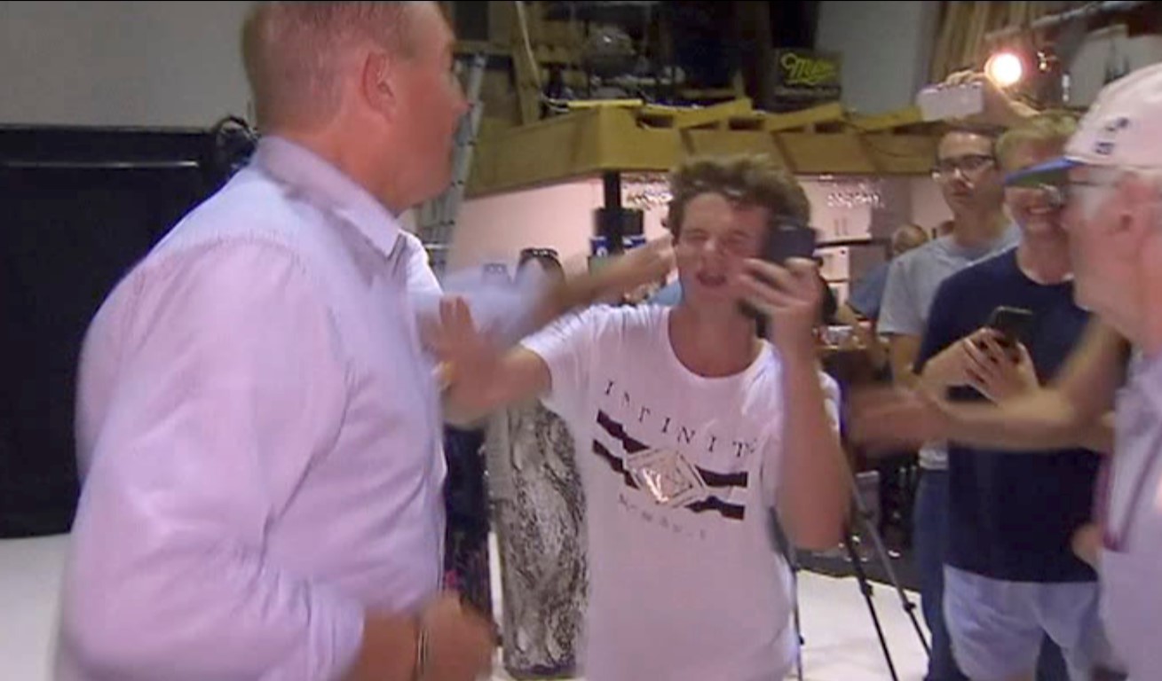 Fraser Anning appears to take a swipe at a teenager who broke an egg on his head during a press...
