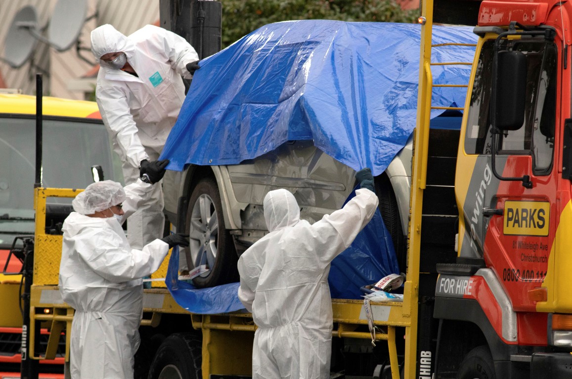 A car allegedly used by the suspect in the Christchurch mosque shootings is covered by police...