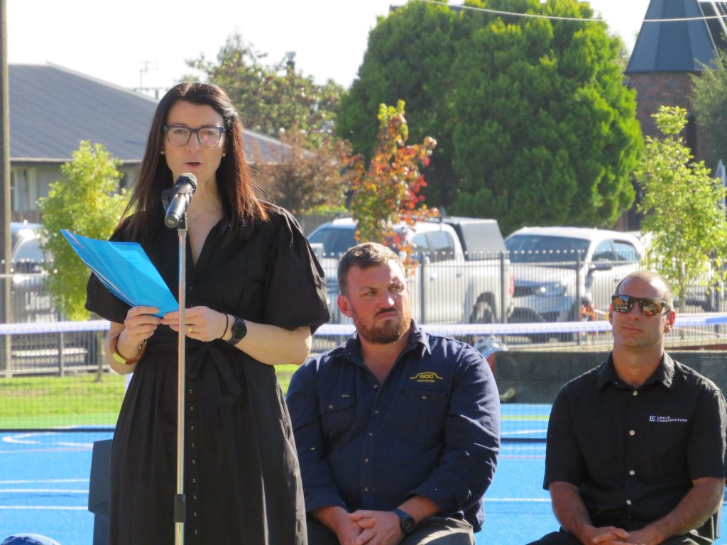 Former Silver Fern Angela Mitchell, flanked by Michael Donaldson and Dave Leslie, at the opening...