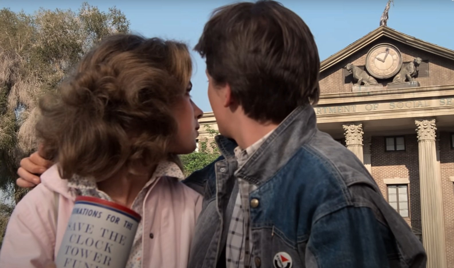 Marty McFly and Jennifer Parker are badgered for a donation to keep the clock broken.