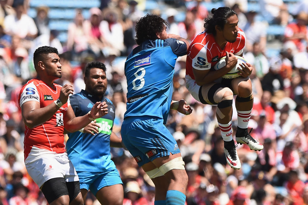 Ryohei Yamanaka of the Sunwolves competes for the ball against Steven Luatua of the Blues. Photo:...