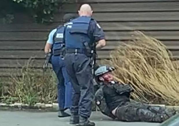 A bloodied Tarrant was dragged from his vehicle by the armed arresting officers, who later...