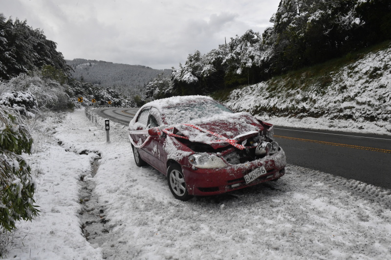 One of several cars that crashed in snow on the Northern Motorway, which has now reopened. Photo:...