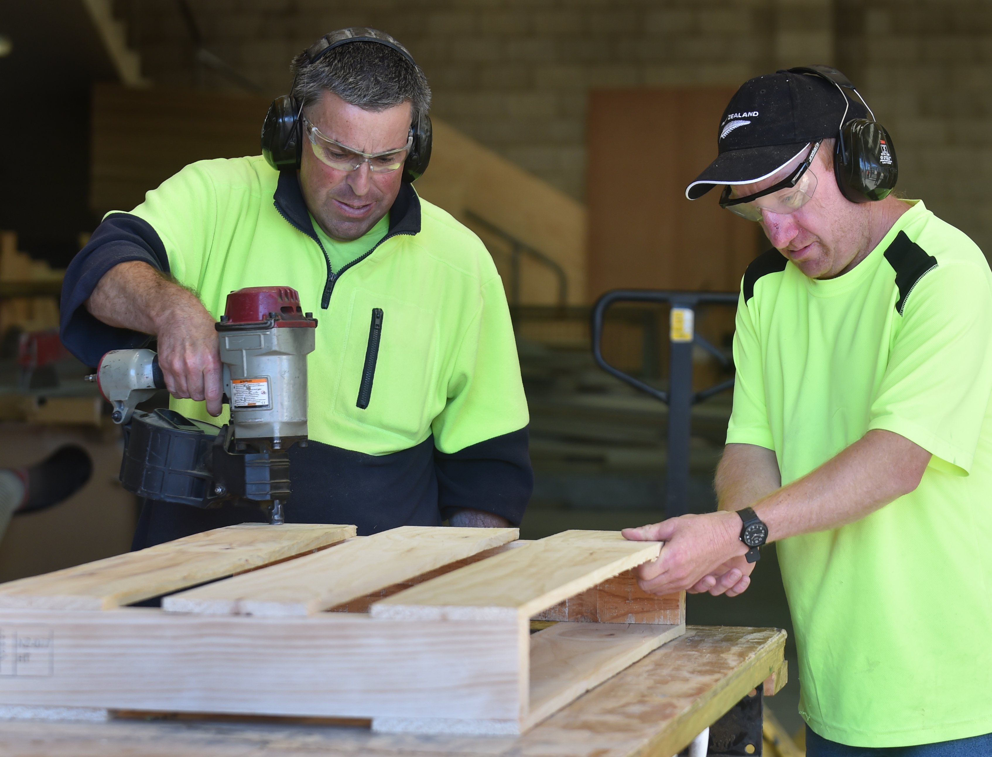 Shayne Anderson (left) and Glen Pert put a pallet together. PHOTO: PETER MCINTOSH