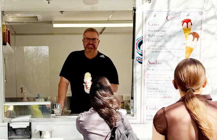 New Ice Cream Charlie owner Gareth Eddy serves his first ice cream. Photo: Ice Cream Charlie...