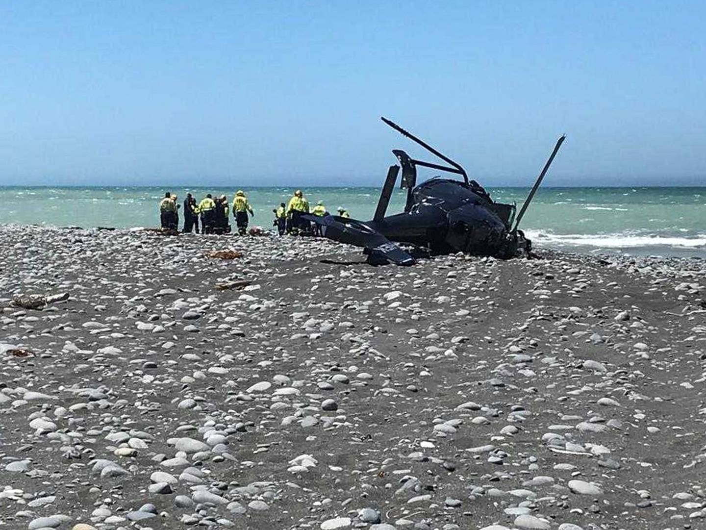 The helicopter was pulled out of the tide and up the beach. Photo: Canterbury West Coast Air Rescue