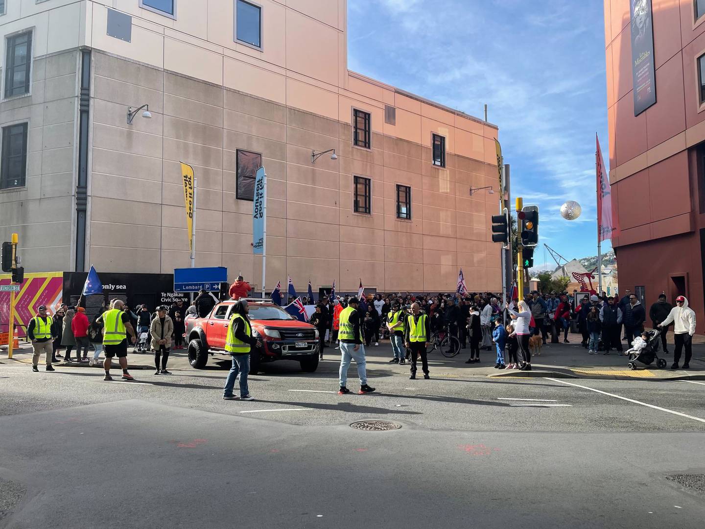 Members of the Wellington protest group leave Civic Square before blocking traffic in several...