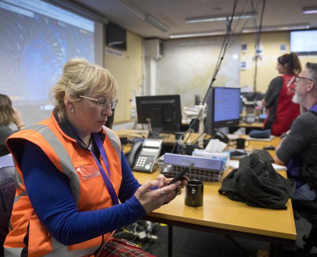Dunedin Mayor Sophie Barker checks a weather update in the Dunedin Civil Defence headquarters....