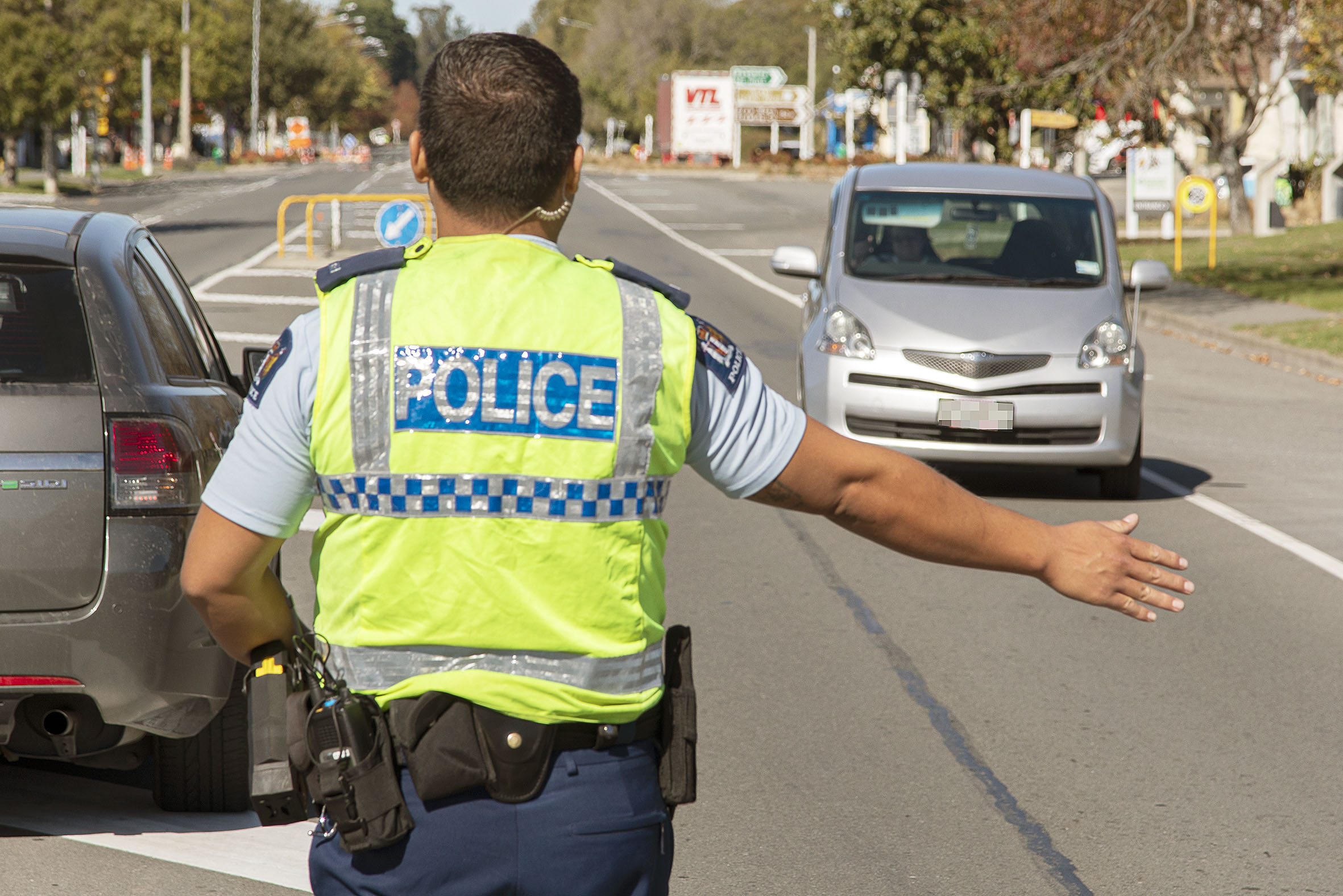 Police stop motorists at a checkpoint in  Amberley. Photo: Geoff Sloan