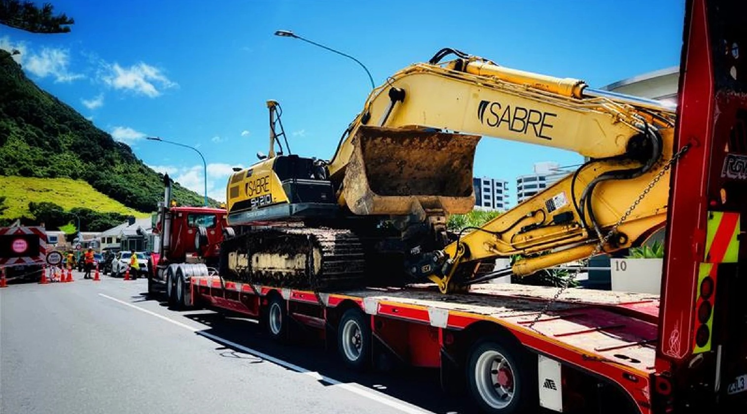 A digger is brought in to the Mount Maunganui cordon to help with the search on Friday afternoon....