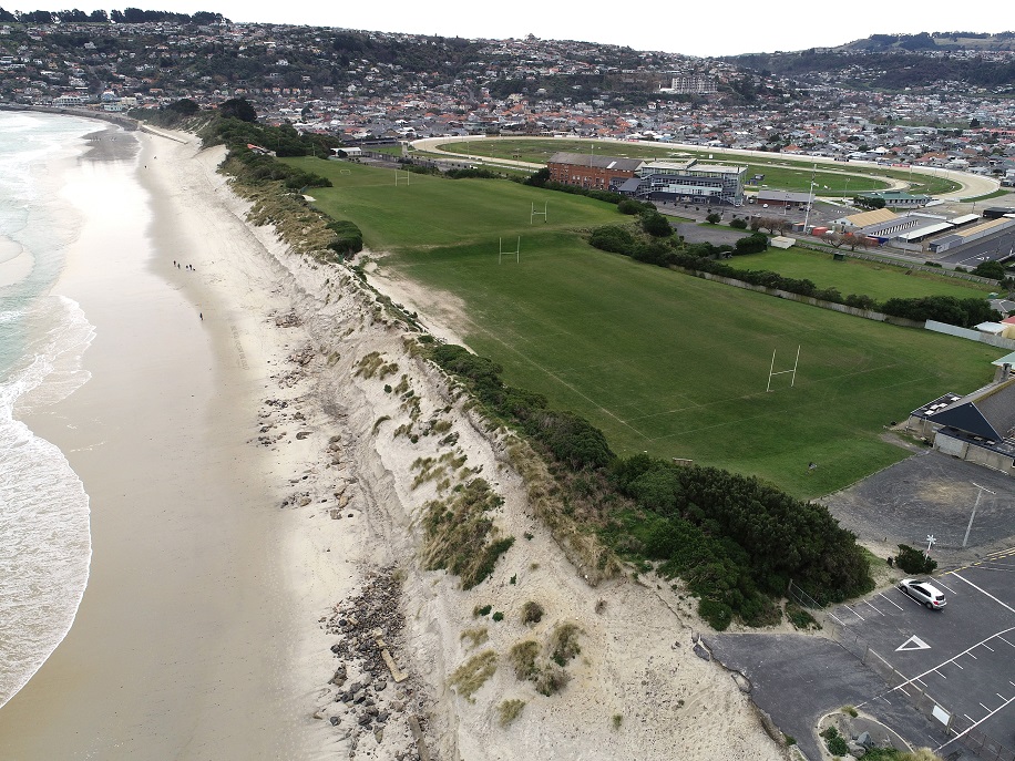 This aerial photograph shows the steep scarp, rocks and other rubble left behind after erosion at...