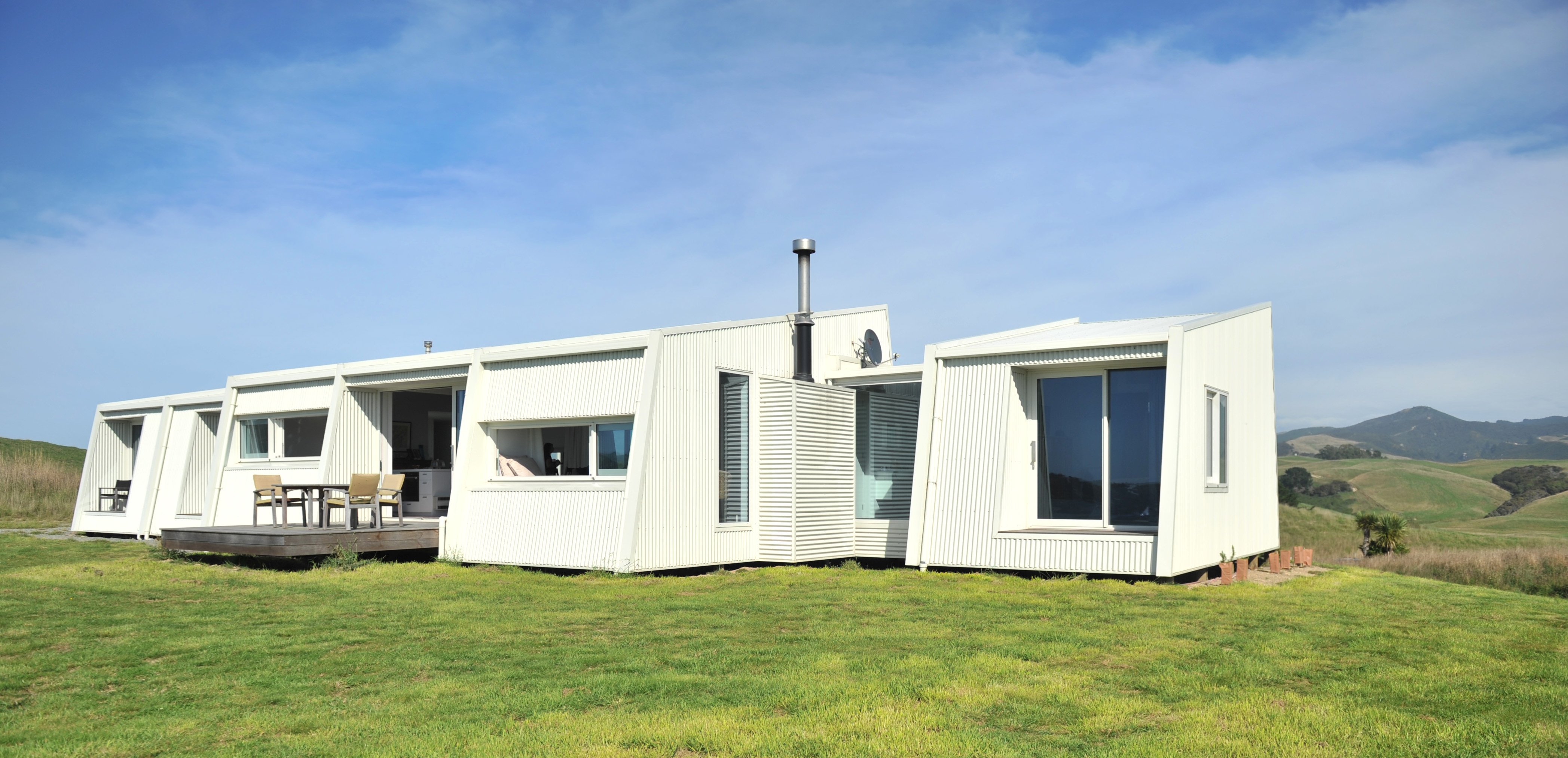 This house is built across its Moeraki site to capitalise on the views. The exterior is painted a...