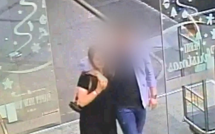 The defendant and Grace Millane hug when meeting for the first time at the base of the Sky Tower...