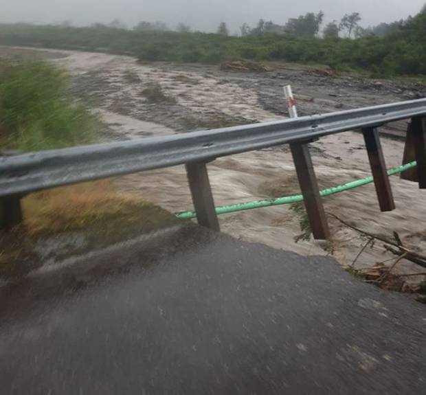 A swollen river under the bridge near Te Taho. Photo: Facebook via NZ Herald 