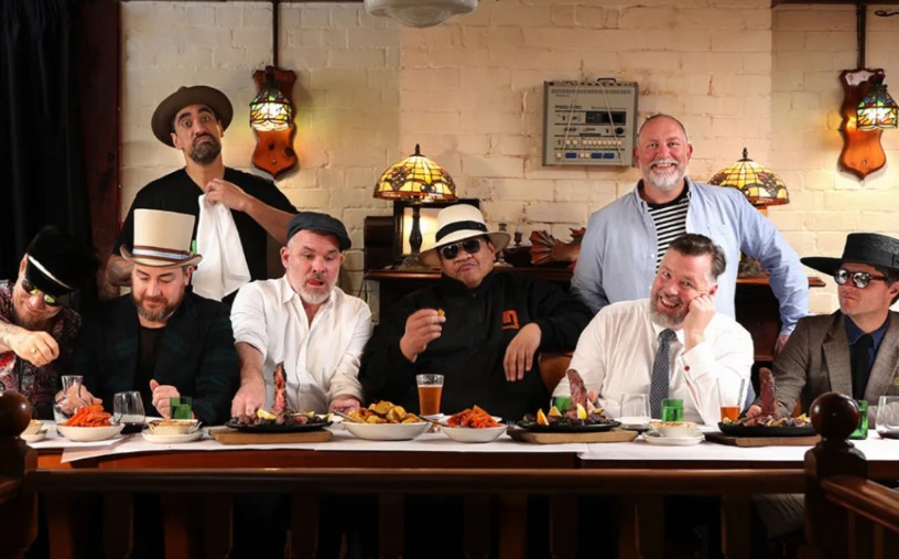 Fat Freddy's Drop - Chris Faiumu seated in the middle in the white fedora hat - photographed in...