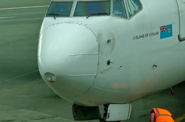 A large dent could be seen in the nose of the Fiji Air flight after it finally managed to land in...