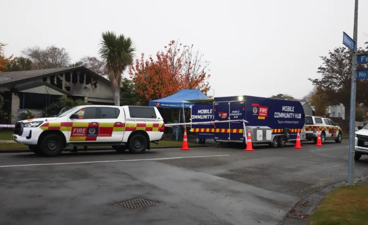 Emergency service vehicles remain at the scene today. Photo: RNZ / Louis Dunham