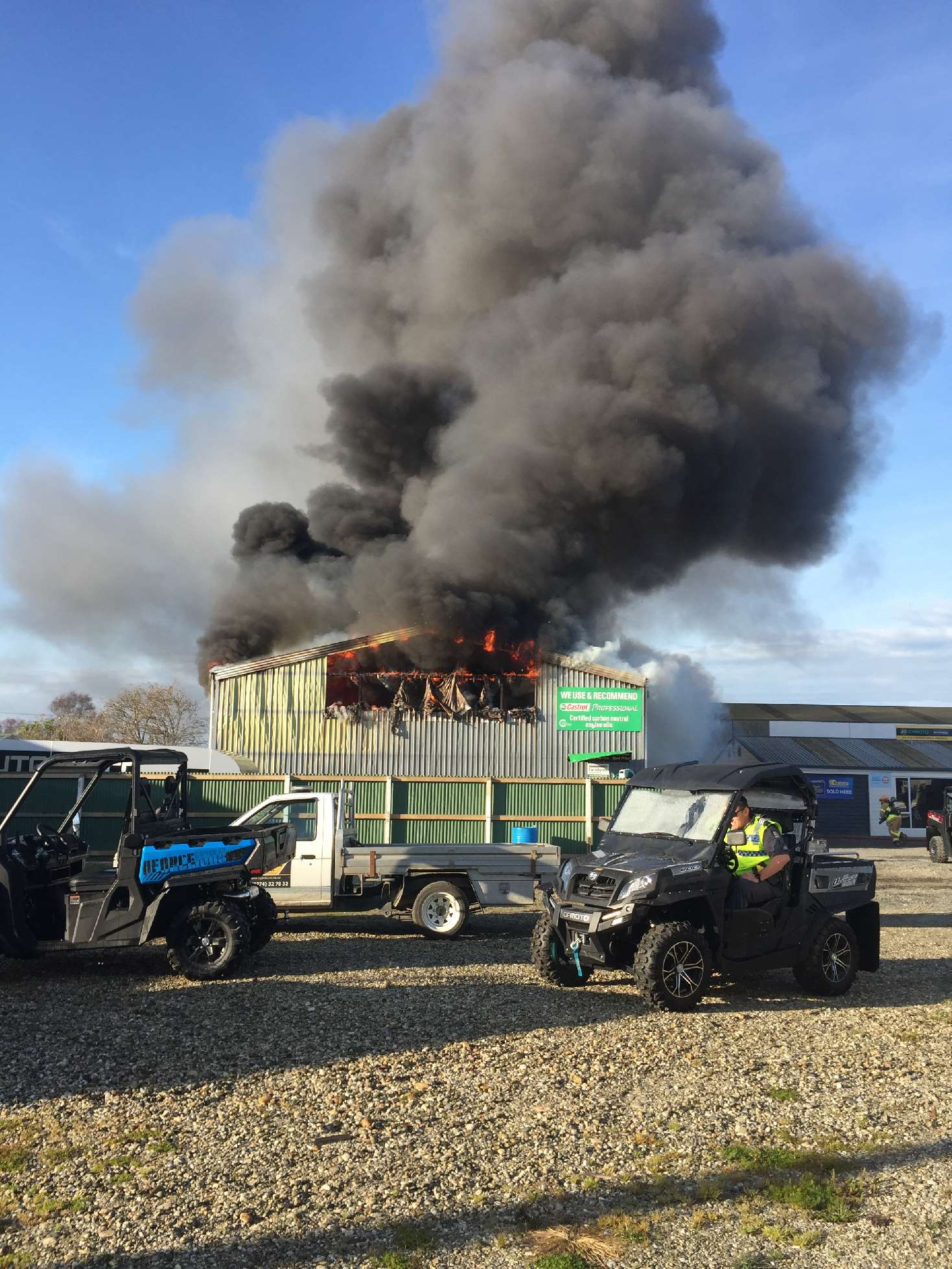 Thick acrid smoke from the fire filled the surrounding air. Photo: John Cosgrove