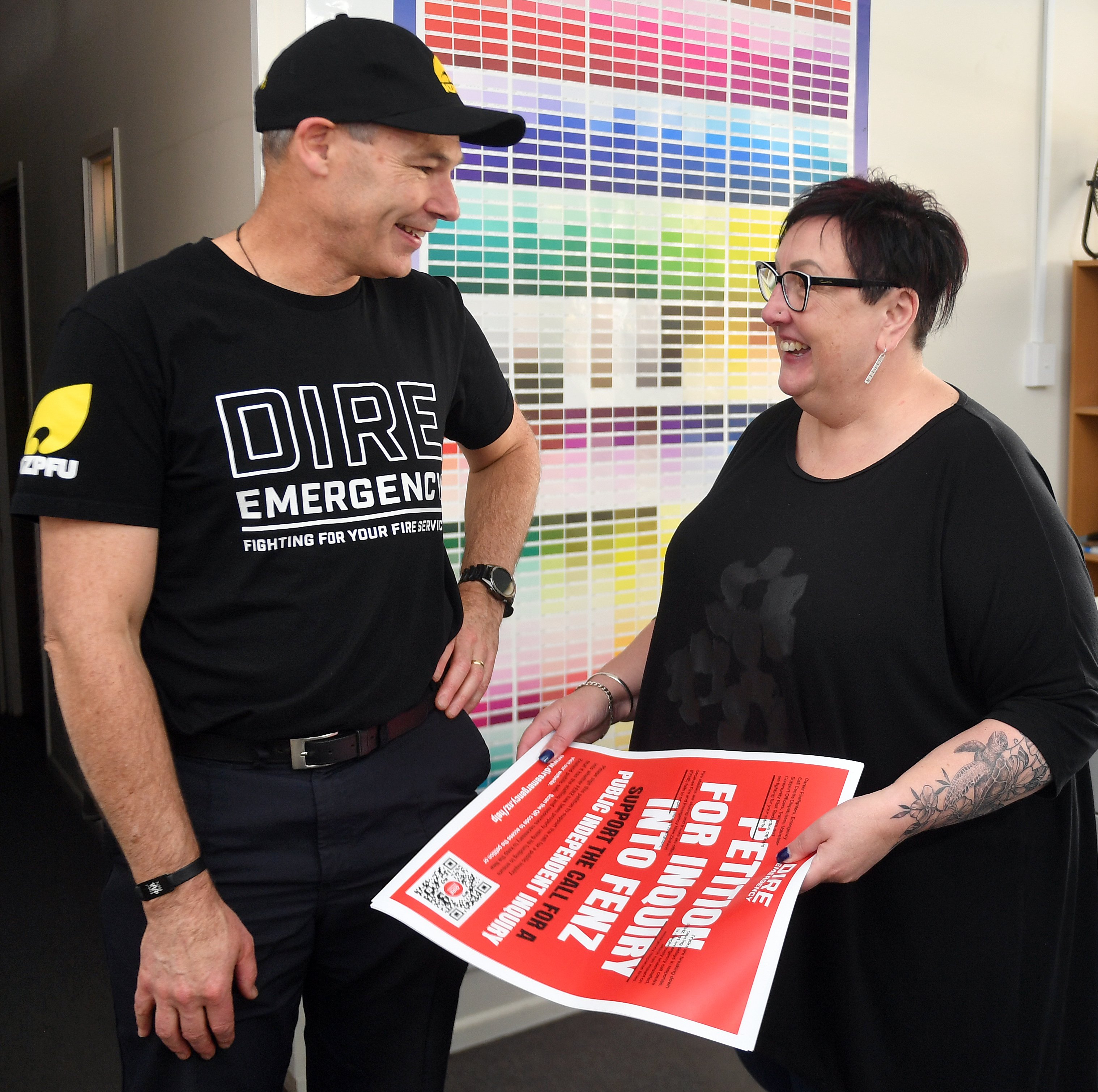 Dunedin Senior Station Officer Martin Hastie reunites with Dunedin Print owner Angela Gillan...