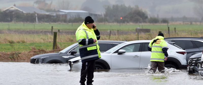 Flooded cars at a share rental car premises at the Dunedin Airport following heavy rain in...