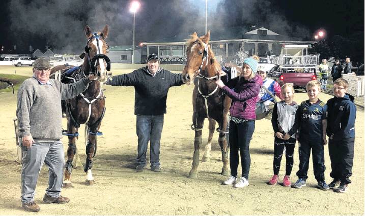 Owners John (left) and Shane Cleland and Dawn Wilson and their supporters greet quinella makers...